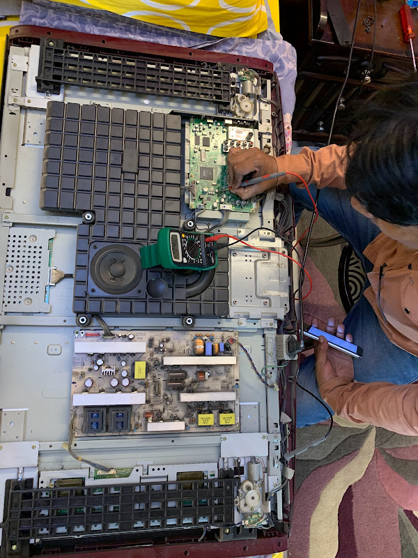 Technician repairing LED TV at Repair Tronics